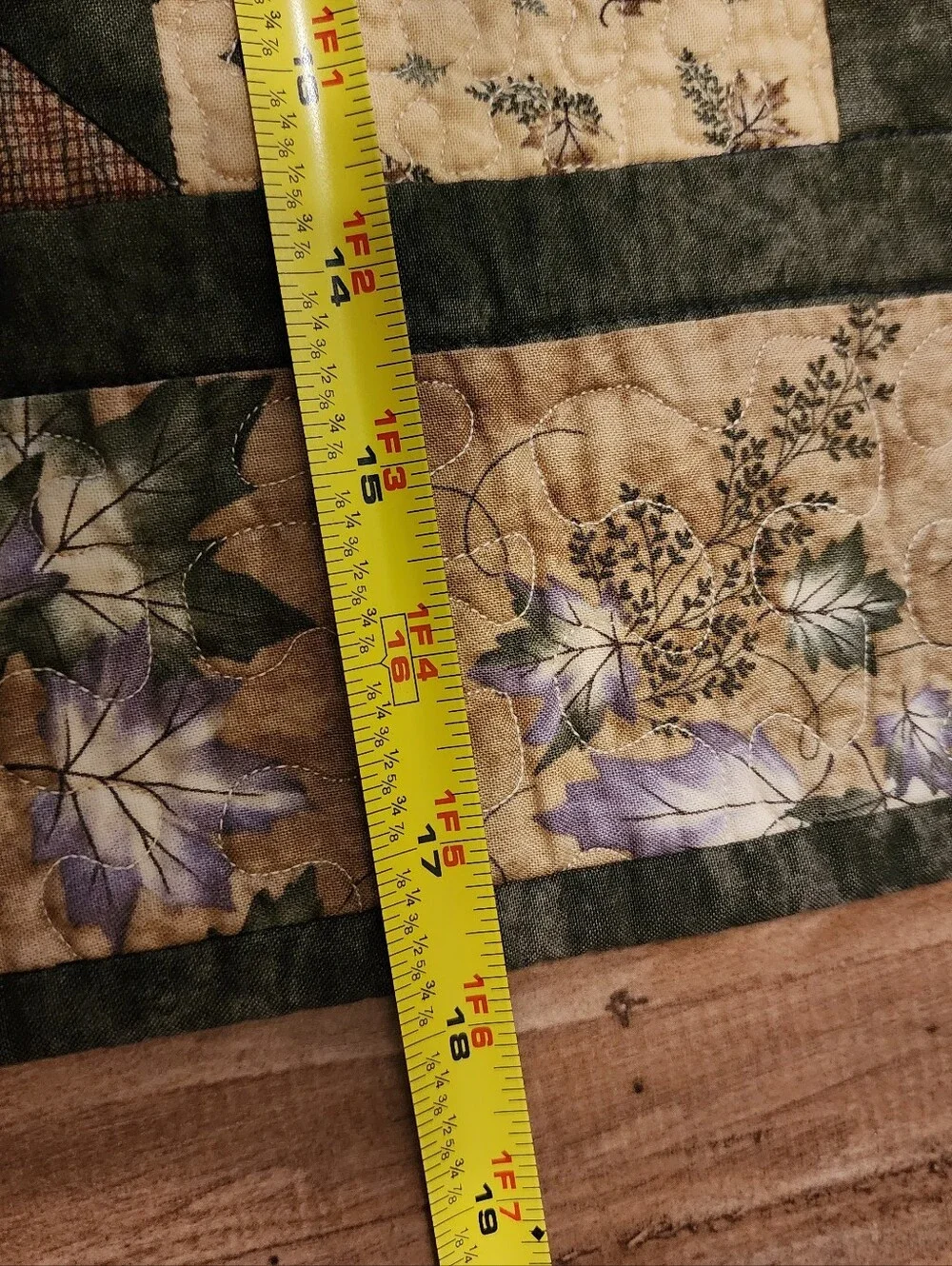Green, brown and beige quilted table topper